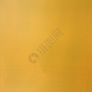 Rusty黄色涂漆钢铁金属含灰片的背景图片