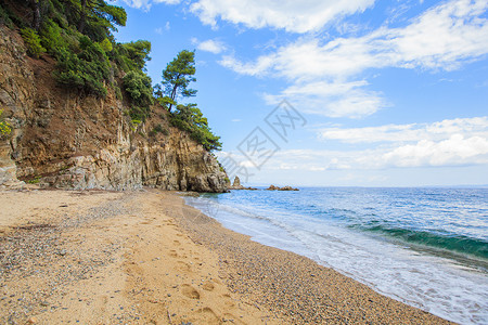 美丽的夏季海景暑假旅行假期希腊的海水和岩石图片