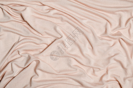 柔和的粉红色丝绸材料特写的背景图片