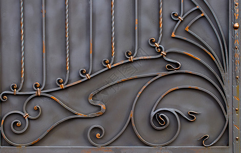 带门的铁艺栅栏的细节和装饰品背景图片