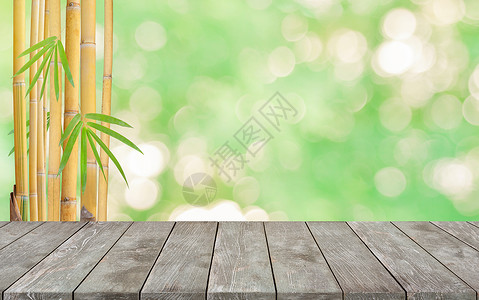 空的旧木桌与黄色竹树背景背景图片