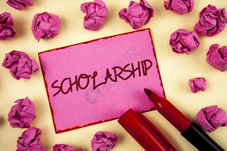 文字写作文本奖学金为支持教育而进行的赠款或付款的商业概念以粉红色便笺纸为背景背景图片
