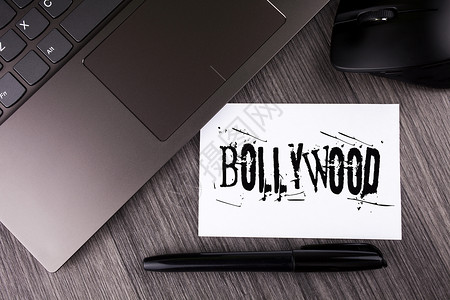 燃油宝名片Bollywood商业图片展示印度电影院的娱乐来源笔记本纸木制背景笔鼠PaptopMous背景