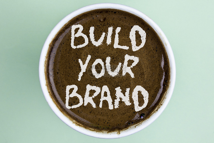 显示建立您的品牌的书写笔记商业照片展示创建您自己的标志口号模型广告电子营销在纯色背景下图片