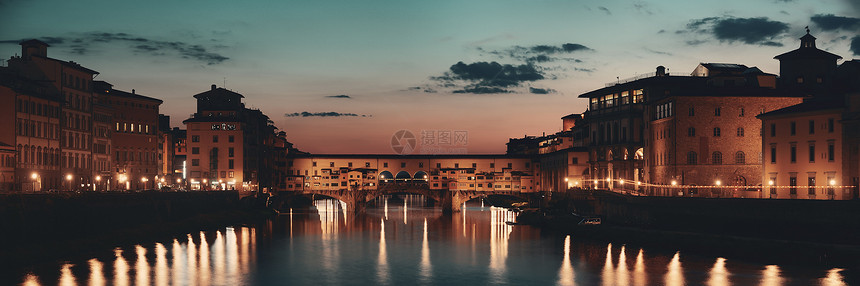 晚上在意大利佛罗伦萨的阿诺河全景上的老桥图片