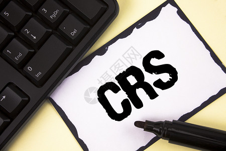 显示Crs的概念手写商业照片文本共享税务财信息的通用报告标准图片