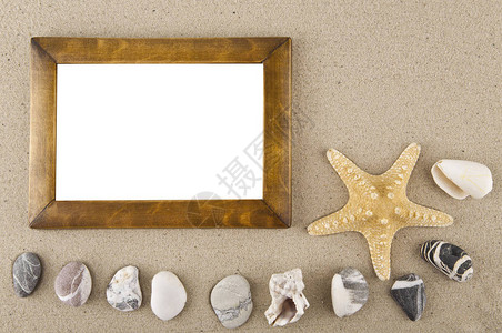 贝壳石头海星和照片框沙供作图片