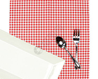 餐桌布上带有叉和勺子的顶端观景板图片