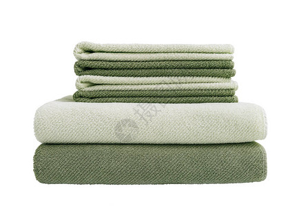 堆叠中大小绿色浴巾堆叠中6条毛巾在白图片