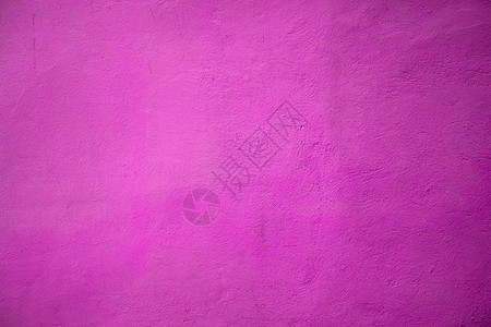 粉红色墙壁的特写镜头覆盖着石膏灰色背景图片