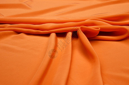 双绉橙色丝织品背景图片