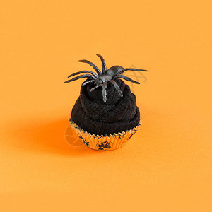 用于烤蛋糕模仿蛋糕和橙色背景的蜘蛛图片