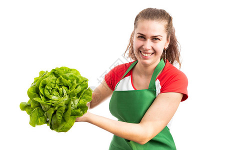 年轻女杂货或零售店女雇员将绿色生菜作为新鲜健康维生素产品广告概念图片