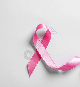 白色背景上的粉红丝带顶视图癌症意识图片