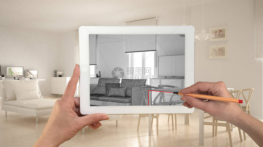 手握和用平板图画显示现代客厅CAD草图在背景中真正完成的最小白色项目图片