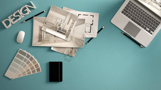 建筑师设计师概念带电脑的蓝色办公桌纸稿厨房项目图像和蓝图背景图片