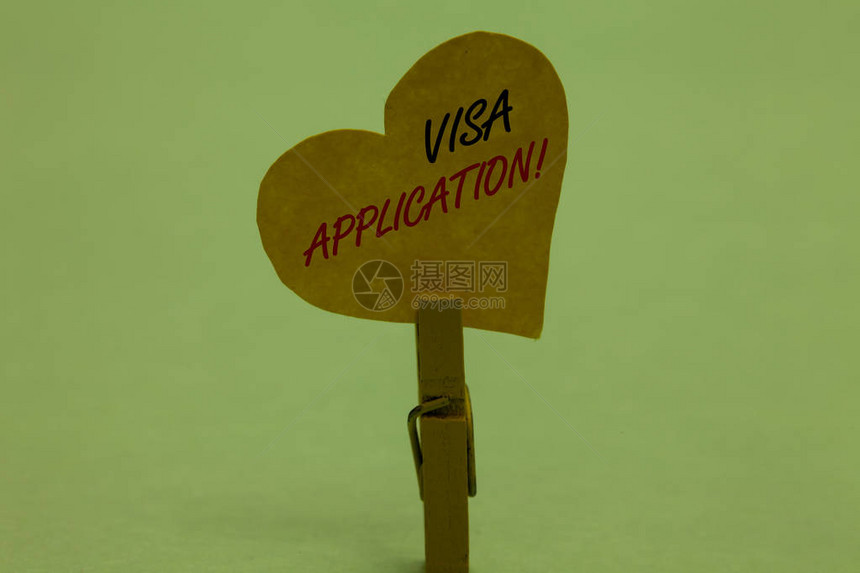 手写文本签证申请概念意义表请求允许旅行或居住在另一个青瓷色背景回形针持图片