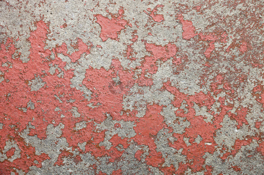 红色砂砾墙纹理从表面溶解图片