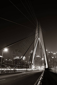 重庆市的桥梁和城市建筑夜背景图片