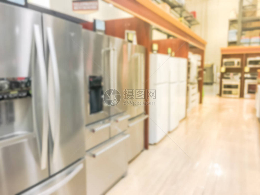 带制冰机的全新法式对开门冰箱的广泛选择美国德克萨斯州欧文市的一排不锈钢冰箱运动模糊零图片