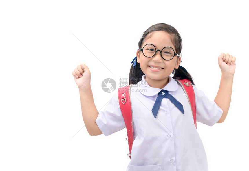 快乐的小女孩学生站立和微笑图片