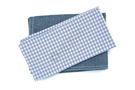 白色背景上的蓝色方格餐巾桌衣服图片