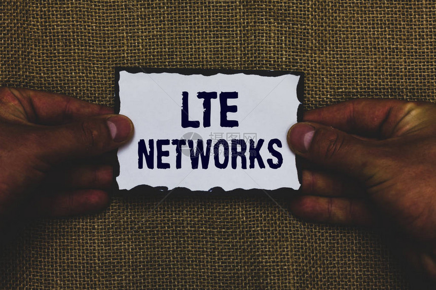 手写文本Lte网络概念含义可用于无线通信的最快网络连接人手持纸黑边黄麻背图片
