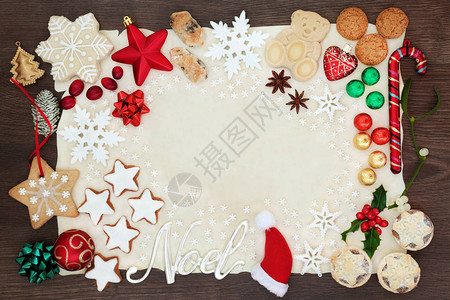 诺埃尔和圣诞背景边界有银牌和树木装饰品雪花饼干蛋糕巧克力和冬季植物图片