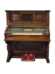 古老的直立德国式自动钢琴在白色图片