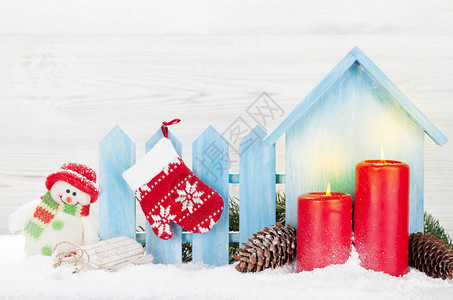 圣诞雪人手套滑雪玩具蜡烛和fir树枝Xma带复图片
