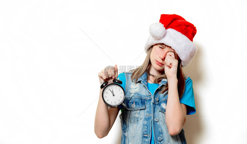 年轻少女在圣诞礼帽上画像白色背图片