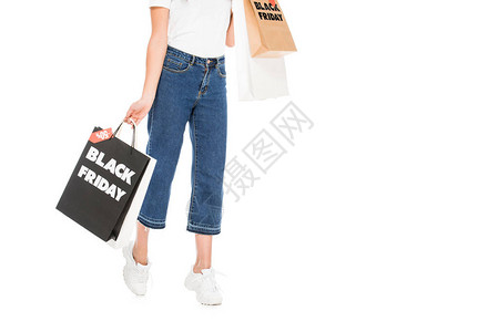 以白色隔绝的黑色星期五销售标志持有袋式购物袋和高清图片