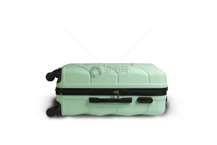 带轮子的浅绿色手提箱躺在白色背景上图片
