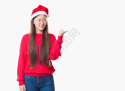 身处孤立的年轻女子戴着圣诞帽图片