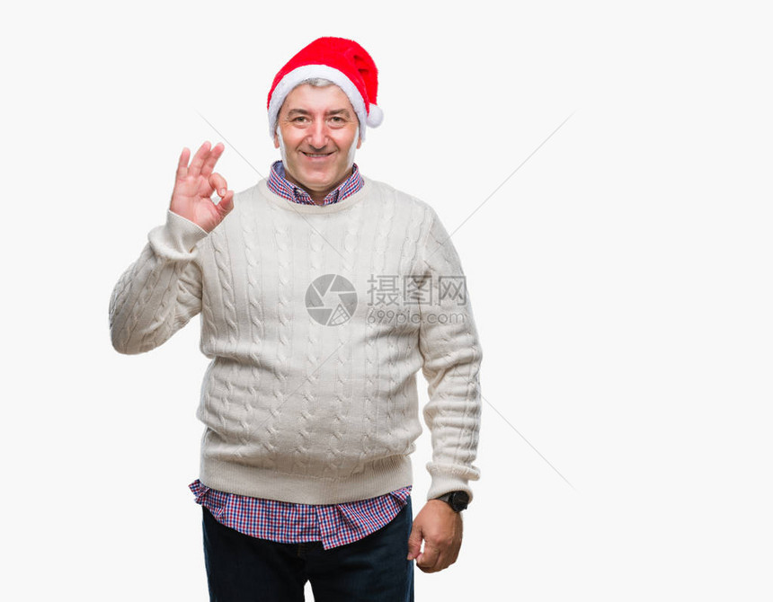 穿着圣诞帽的英俊老人在孤立的中微笑着正面用手和指做一个好标记图片