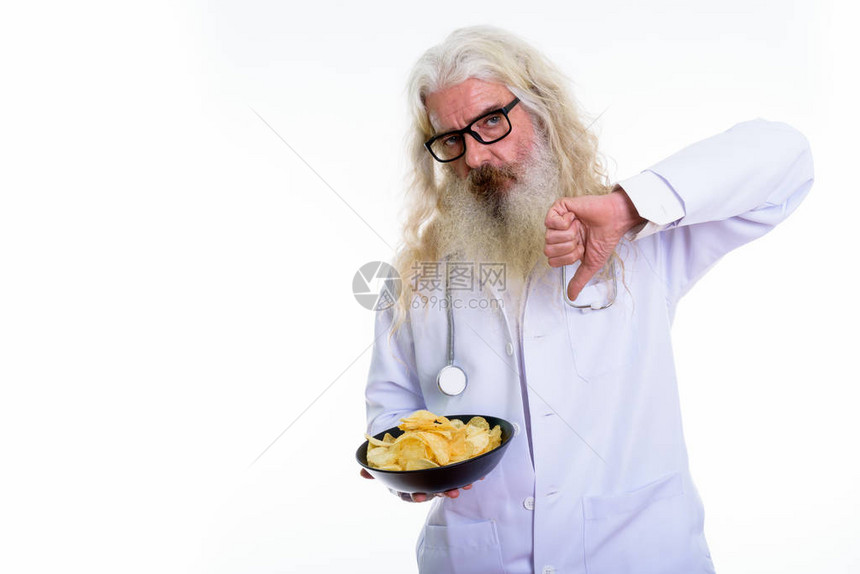 工作室的一拍长胡子老人大胡子医生在拿着土豆薯图片