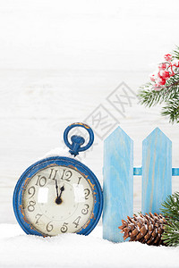 圣诞闹钟和fir树枝图片