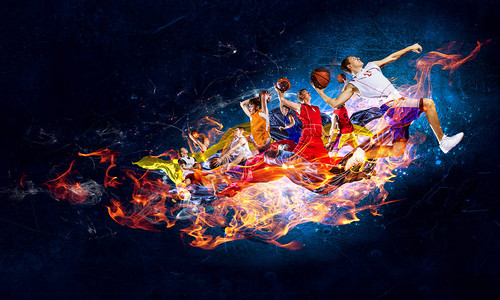 黑暗背景下火焰中的超级篮球运动员图片