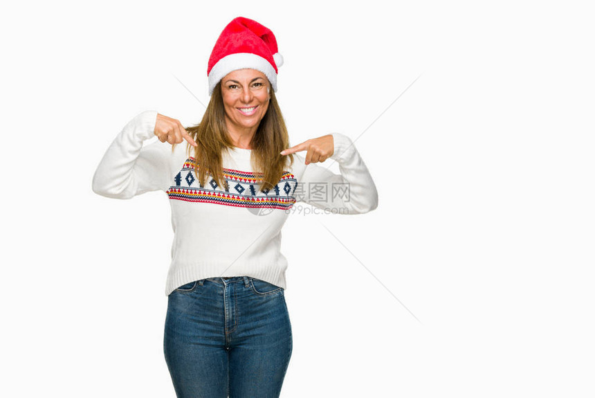 中年成女身穿冬季毛衣和圣诞帽图片