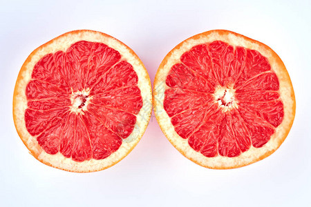 两半多汁的葡萄柚成熟的美味葡萄柚在浅色背景上切成两部图片