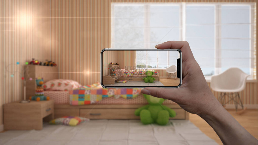 手持智能手机AR应用模拟真实家居中的家具和室内设计产品建筑师设计师概念模糊背景带单人图片
