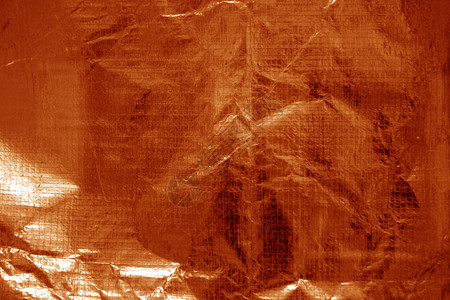 橙色的碎屑透明塑料表面图片