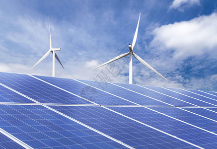 带有风力涡轮机的太阳能电池在蓝天混合电厂图片