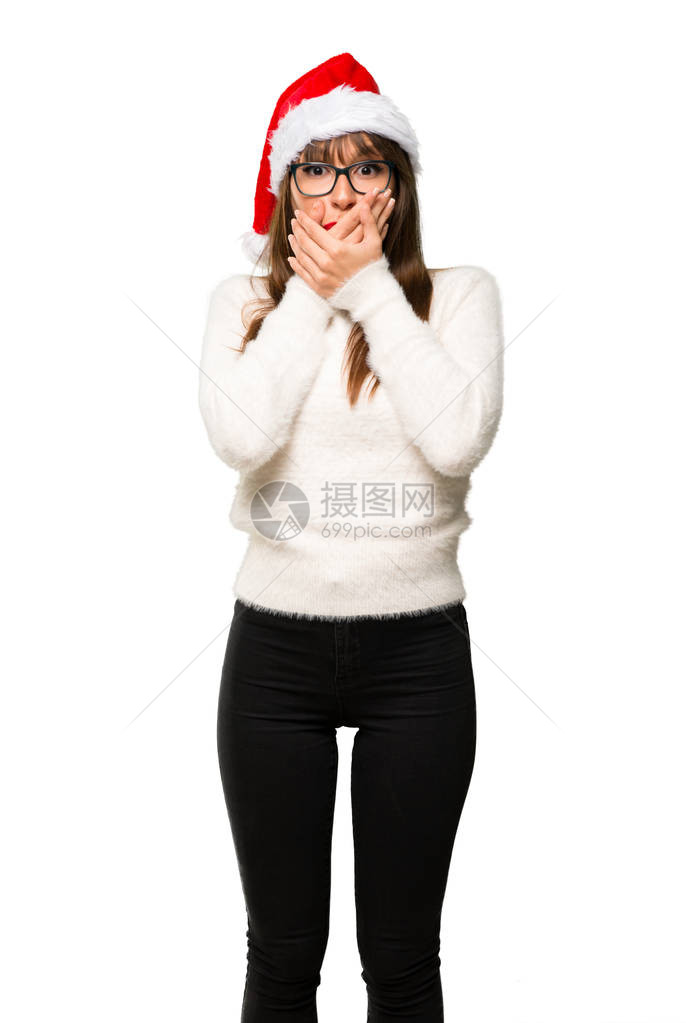 庆祝圣诞节假期的女孩因为说了一些不恰当的话而捂住了嘴不能在孤立的白图片