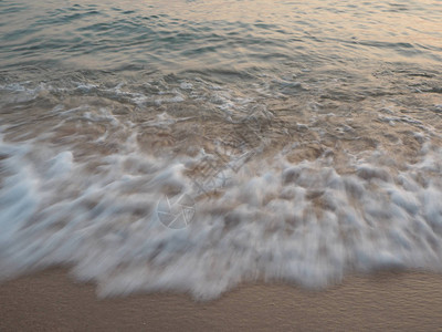 日落时的海和沙图片