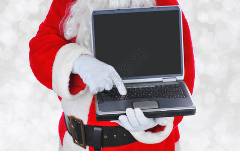 在网络周一圣诞老人在网路上拿着笔图片