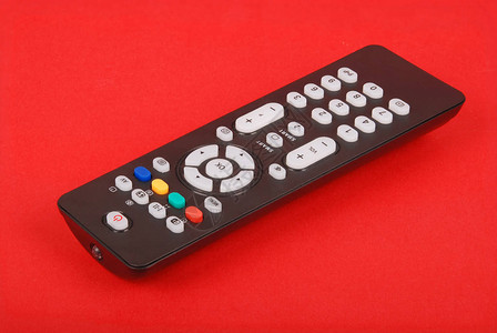 红色背景孤立的电视黑远程控制设备Bla图片