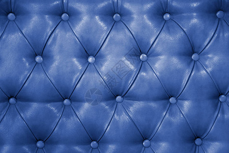 真正的蓝色皮革软垫家具的质地真正的绗缝皮革capitone纹图片