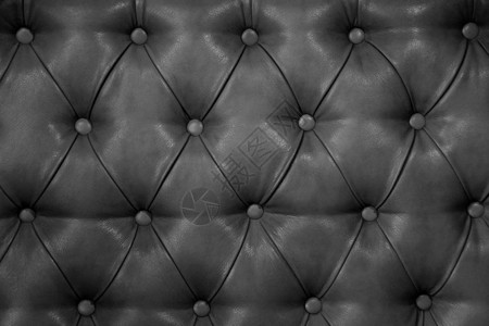 真正的深灰色皮革软垫家具的质地真正的绗缝皮革capitone纹图片