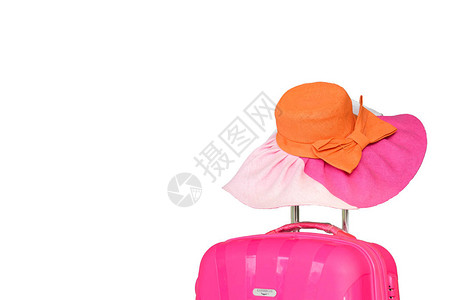 旅行粉色袋和两口子的橙色和粉色帽子在夏季图片